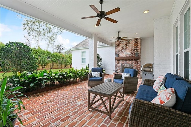 view of patio / terrace with ceiling fan, grilling area, an outdoor kitchen, and outdoor lounge area