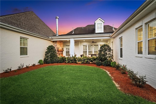 yard at dusk with ceiling fan