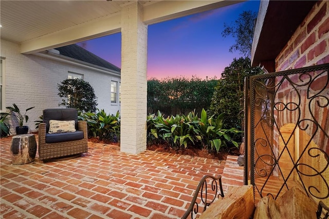 view of patio terrace at dusk