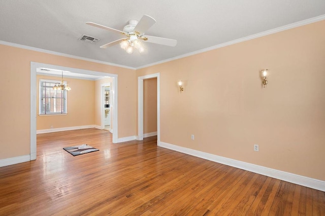 unfurnished room featuring crown molding, ceiling fan with notable chandelier, and hardwood / wood-style floors