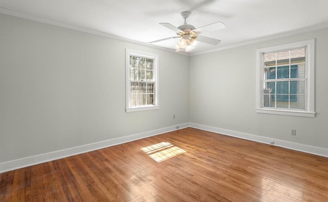 unfurnished room featuring ceiling fan, hardwood / wood-style floors, and crown molding