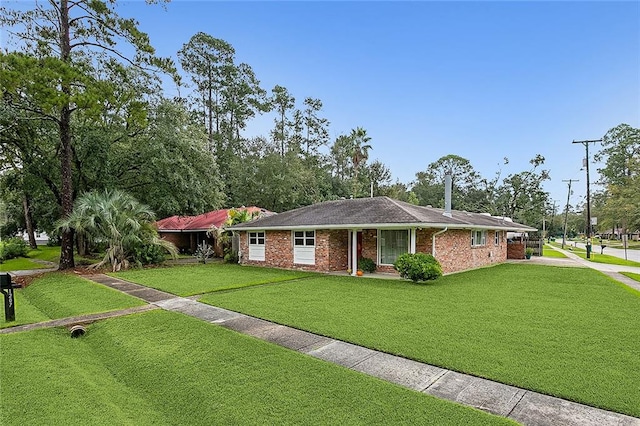 single story home featuring a front yard