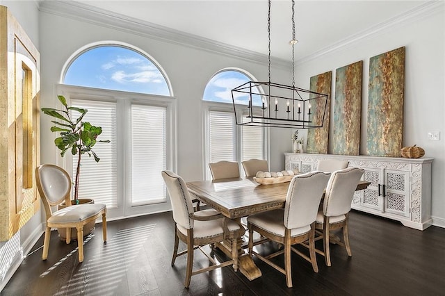 dining room featuring ornamental molding, plenty of natural light, dark hardwood / wood-style flooring, and a chandelier