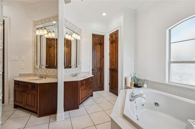 bathroom with a healthy amount of sunlight, ornamental molding, a washtub, and vanity