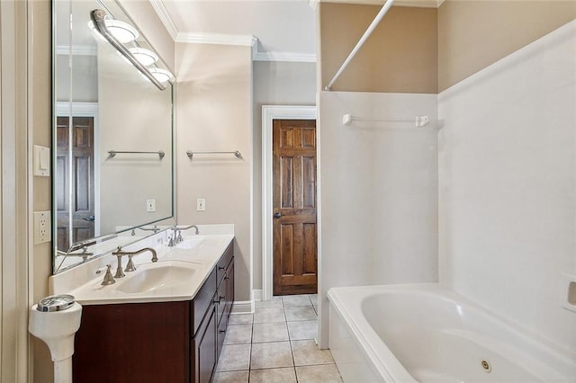 bathroom featuring vanity, tile patterned floors, a tub, and crown molding