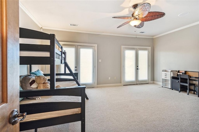 carpeted bedroom featuring ornamental molding and ceiling fan