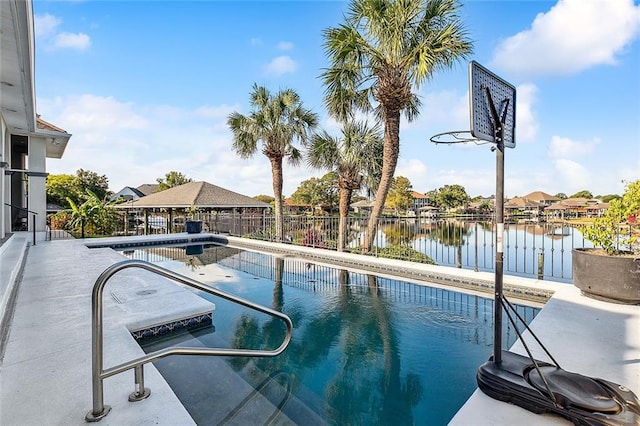 view of pool featuring a water view