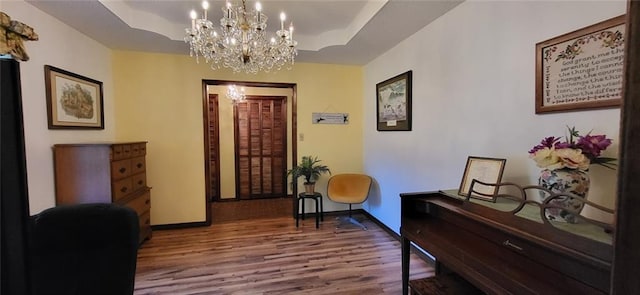 interior space with a chandelier and hardwood / wood-style floors