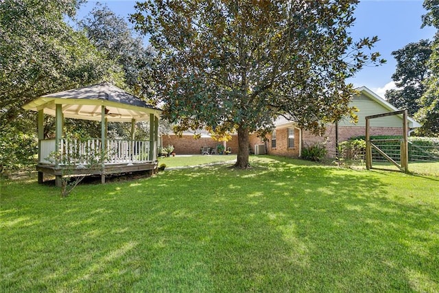 view of yard featuring a gazebo and a deck