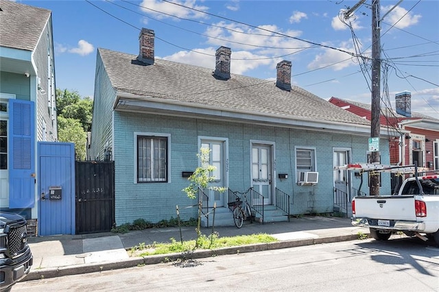 view of front of home with cooling unit