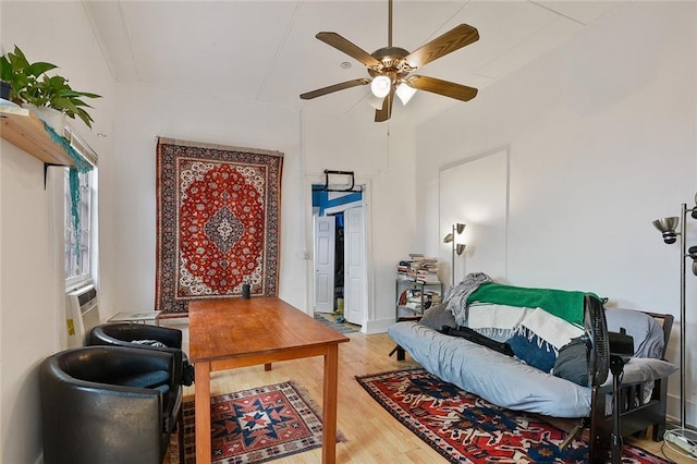 office with ceiling fan and hardwood / wood-style flooring