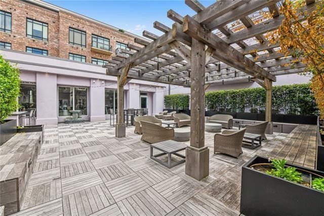 view of patio featuring a pergola and an outdoor living space