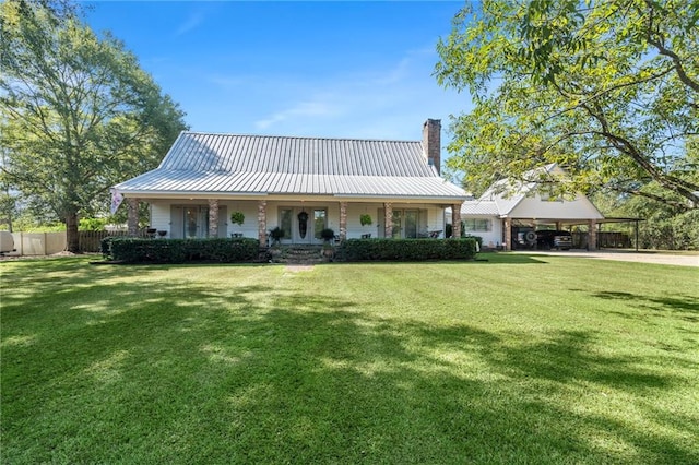 view of front of home with a front lawn and covered porch