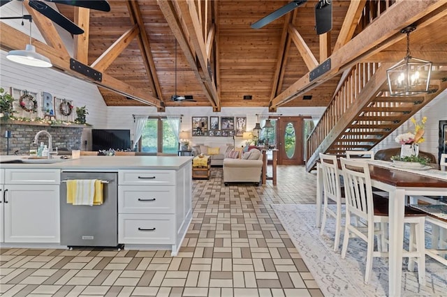 kitchen featuring white cabinetry, dishwasher, an inviting chandelier, decorative light fixtures, and sink