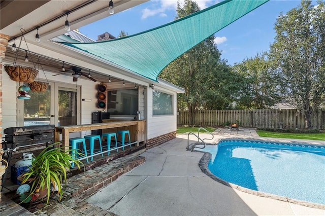 view of pool featuring ceiling fan and a patio area