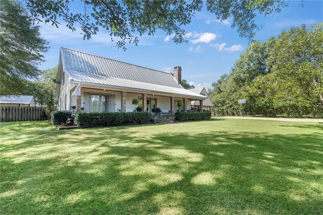 back of house with a yard