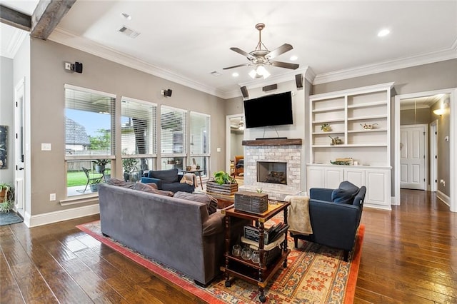 living room featuring ceiling fan, a fireplace, crown molding, and dark hardwood / wood-style floors