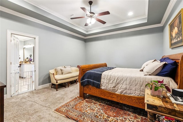 bedroom featuring a raised ceiling, ceiling fan, carpet floors, and ornamental molding