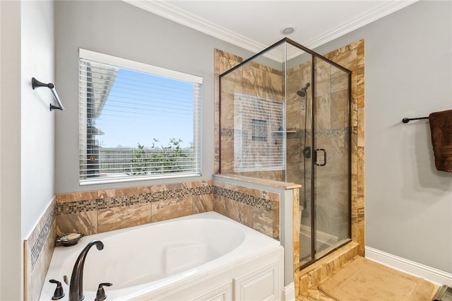 bathroom featuring ornamental molding and shower with separate bathtub