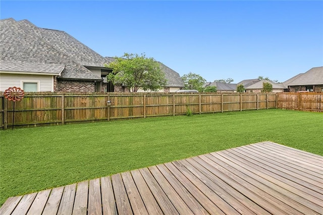 wooden deck with a yard