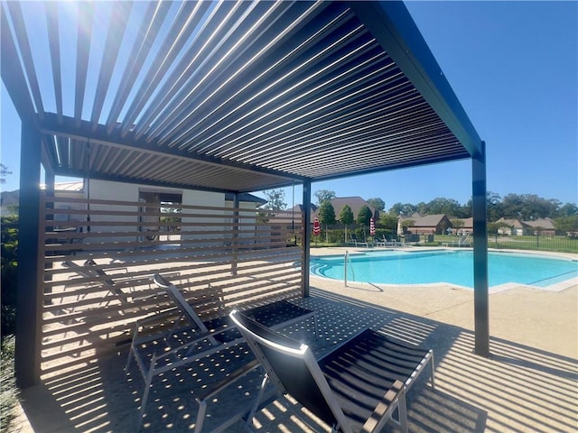 view of swimming pool with a patio area