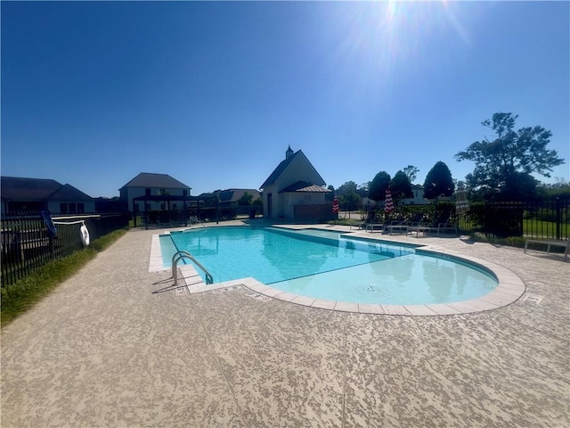 view of pool featuring a patio