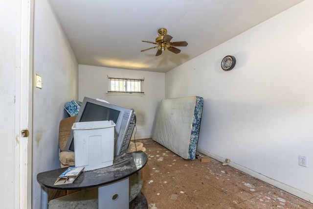 interior space with ceiling fan