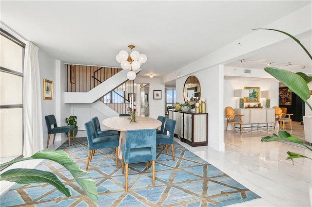 dining room with a notable chandelier