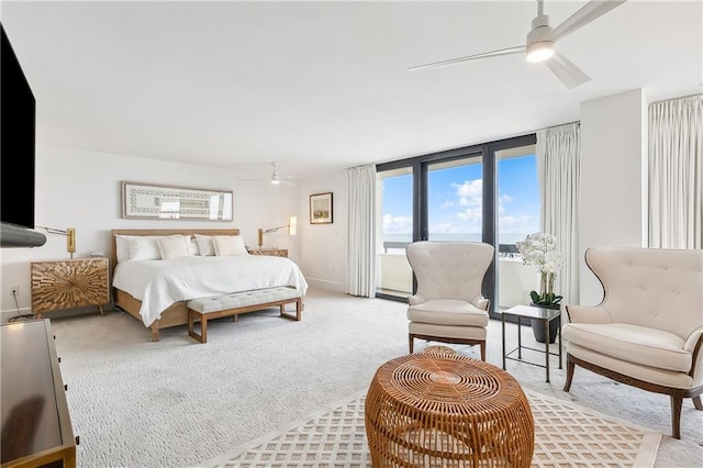 bedroom with ceiling fan and light colored carpet