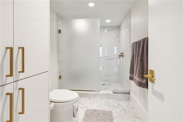 bathroom with walk in shower and toilet