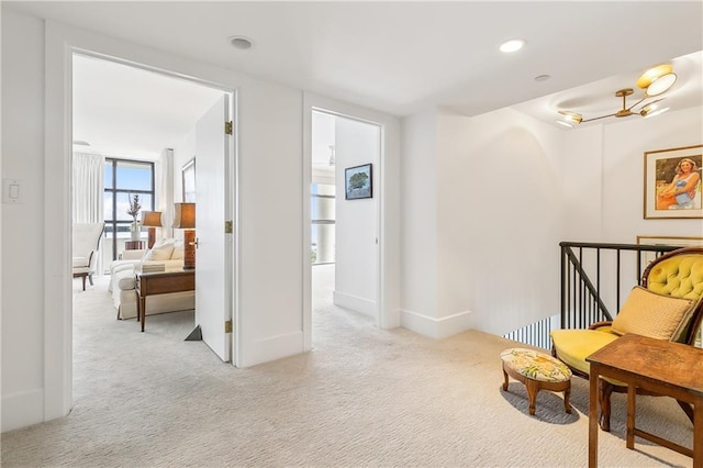 living area featuring light colored carpet