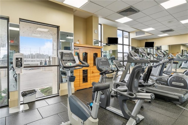 workout area with a paneled ceiling