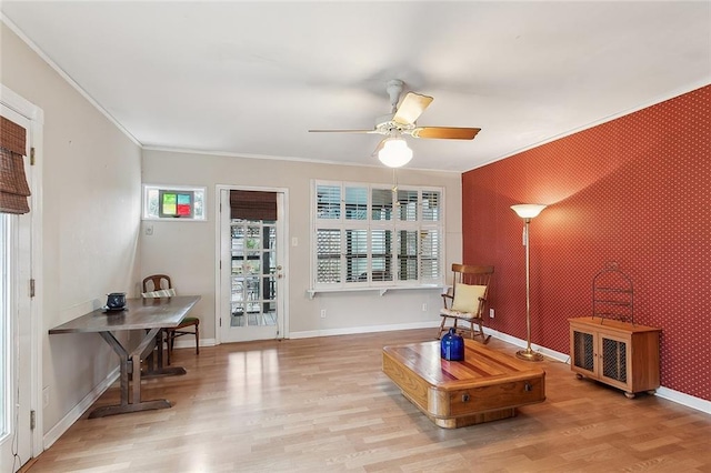 sitting room with crown molding, light hardwood / wood-style floors, and ceiling fan