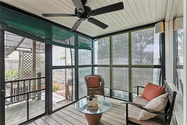 sunroom featuring ceiling fan