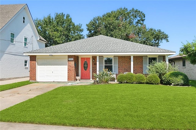 view of front of home featuring a garage and a front lawn