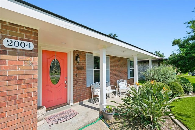 entrance to property with covered porch