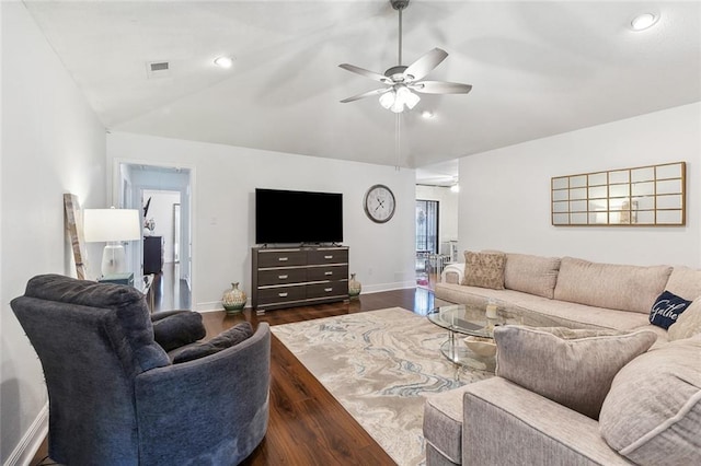 living room with lofted ceiling, dark wood-type flooring, and ceiling fan