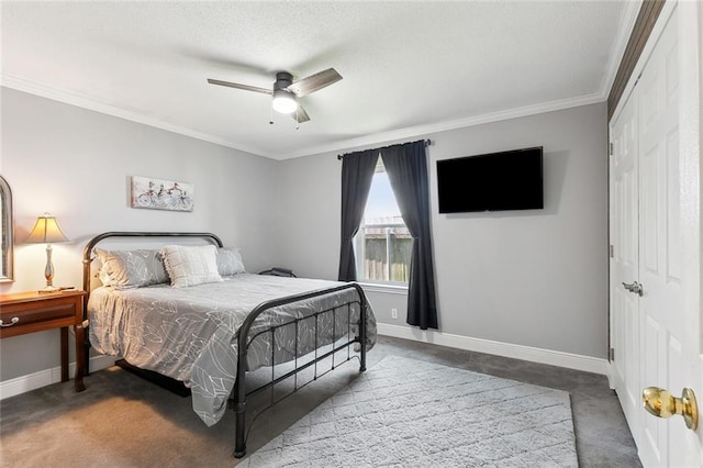 bedroom with carpet floors, crown molding, ceiling fan, and a closet