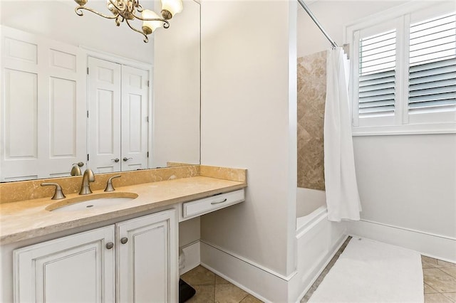 bathroom featuring a notable chandelier, vanity, tile patterned flooring, and shower / tub combo with curtain