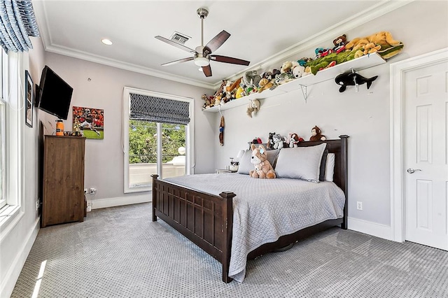 carpeted bedroom with ceiling fan and crown molding