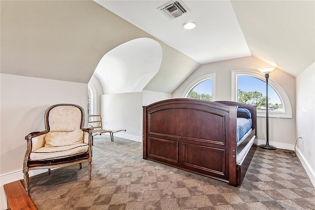 carpeted bedroom featuring lofted ceiling