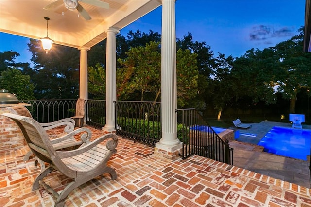 patio terrace at dusk with ceiling fan