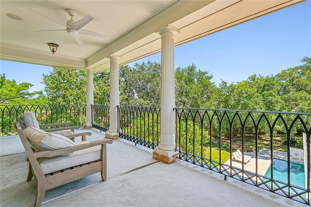 view of patio with ceiling fan and a fenced in pool