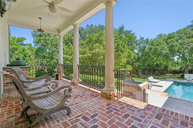 view of patio featuring ceiling fan, a fenced in pool, and a grill