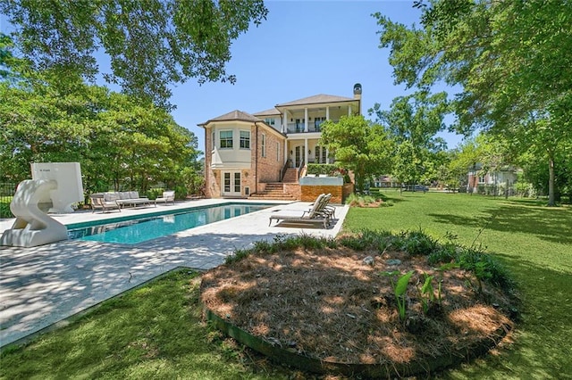 exterior space with a lawn and a patio area