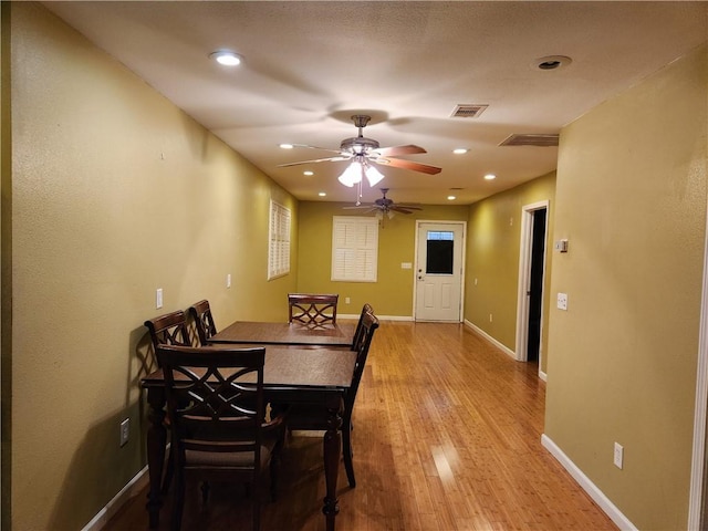 unfurnished living room featuring ceiling fan and hardwood / wood-style flooring