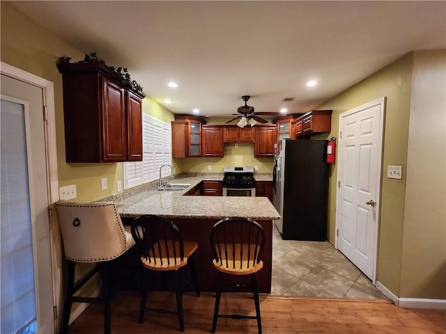 dining area featuring light hardwood / wood-style floors and ceiling fan