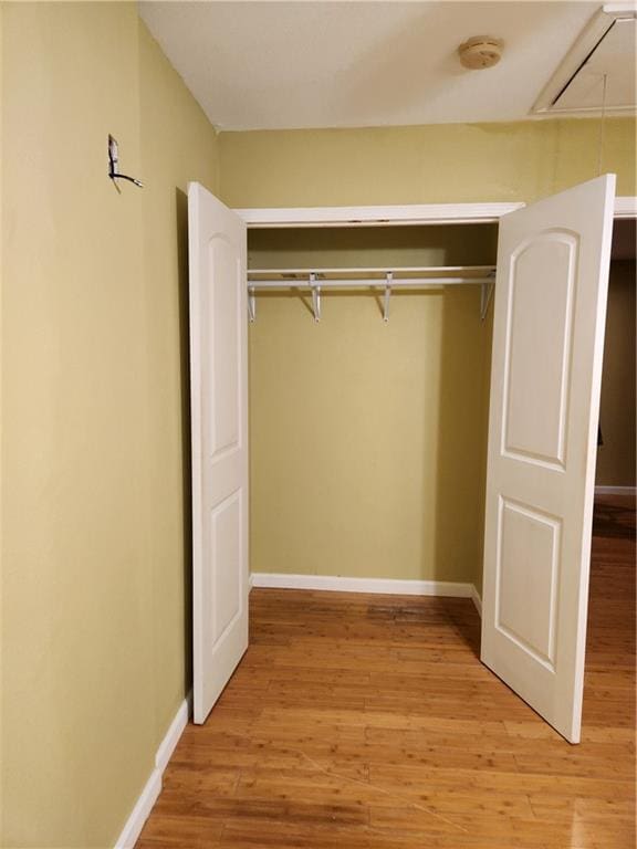 empty room featuring ceiling fan and hardwood / wood-style floors