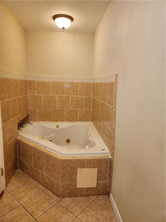 bathroom featuring vanity, tile patterned flooring, and toilet