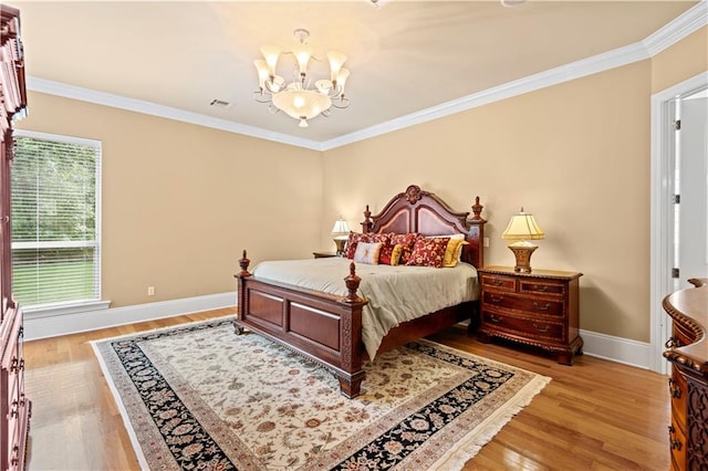 bedroom with ornamental molding and light hardwood / wood-style floors